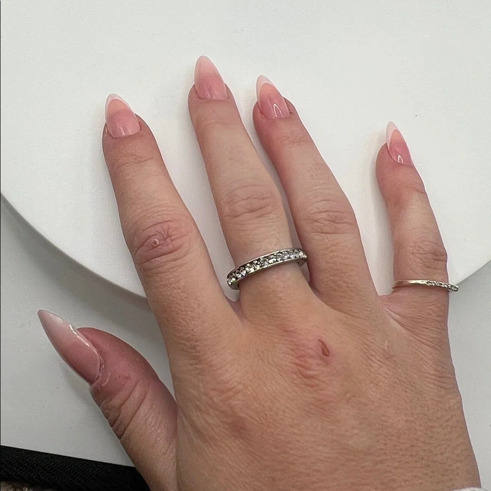 555. White Gold Plated Ring‎ Band Over Stainless Steel with Crystal Accents.